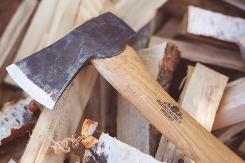 photo of an axe and wood